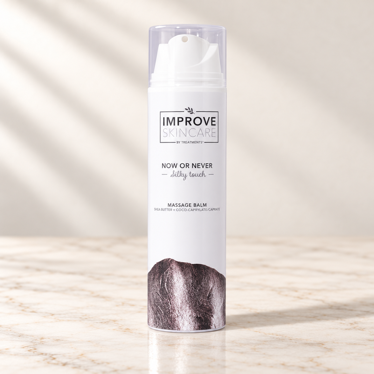 Treatments® - Now and Ever - Silky Touch - Bálsamo de Masaje - 200 ml sobre mármol claro